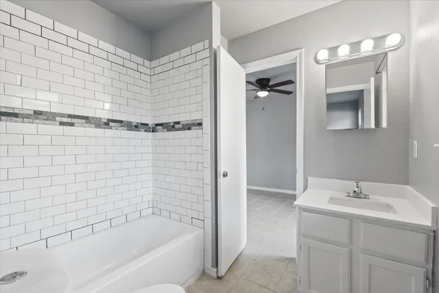 a bathroom with a bathtub and shower