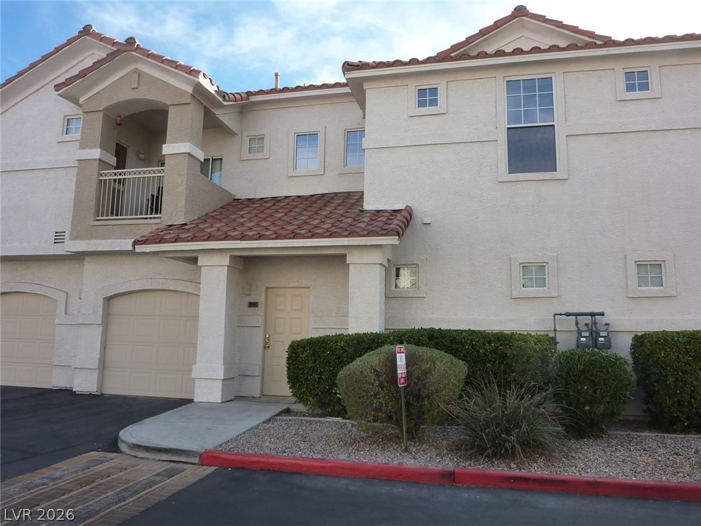 Front of Building with attached 1 car garage