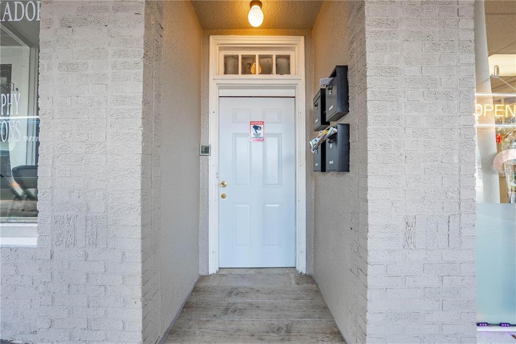 35 North 6th Street, Unit 8 Haines City, FL 33844 - Photo 2 of 17 a view of hallway with stairs