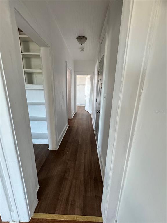 35 North 6th Street, Unit 8 Haines City, FL 33844 - Photo 8 of 17 a view of a hallway with wooden floor and staircase