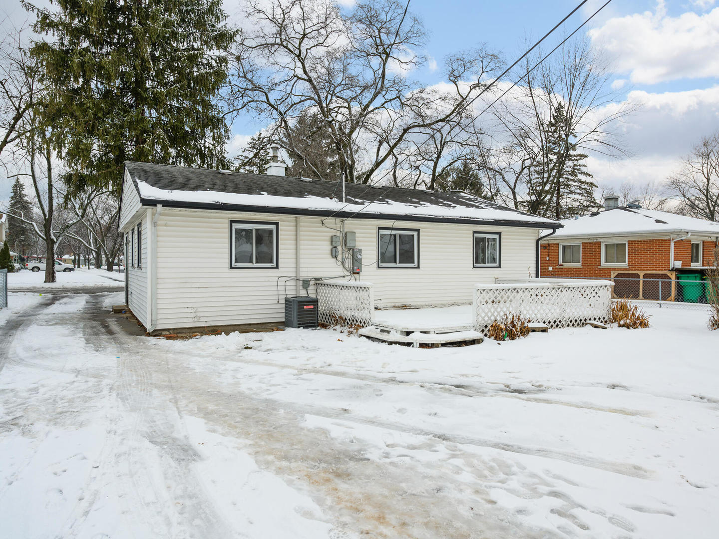 173 East Dennis Road Wheeling, IL 60090 - Photo 15 of 15 a view of a house with snow on the road