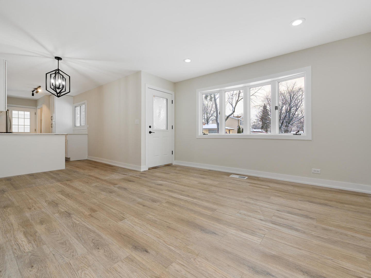 173 East Dennis Road Wheeling, IL 60090 - Photo 3 of 15 wooden floor in an empty room with a window
