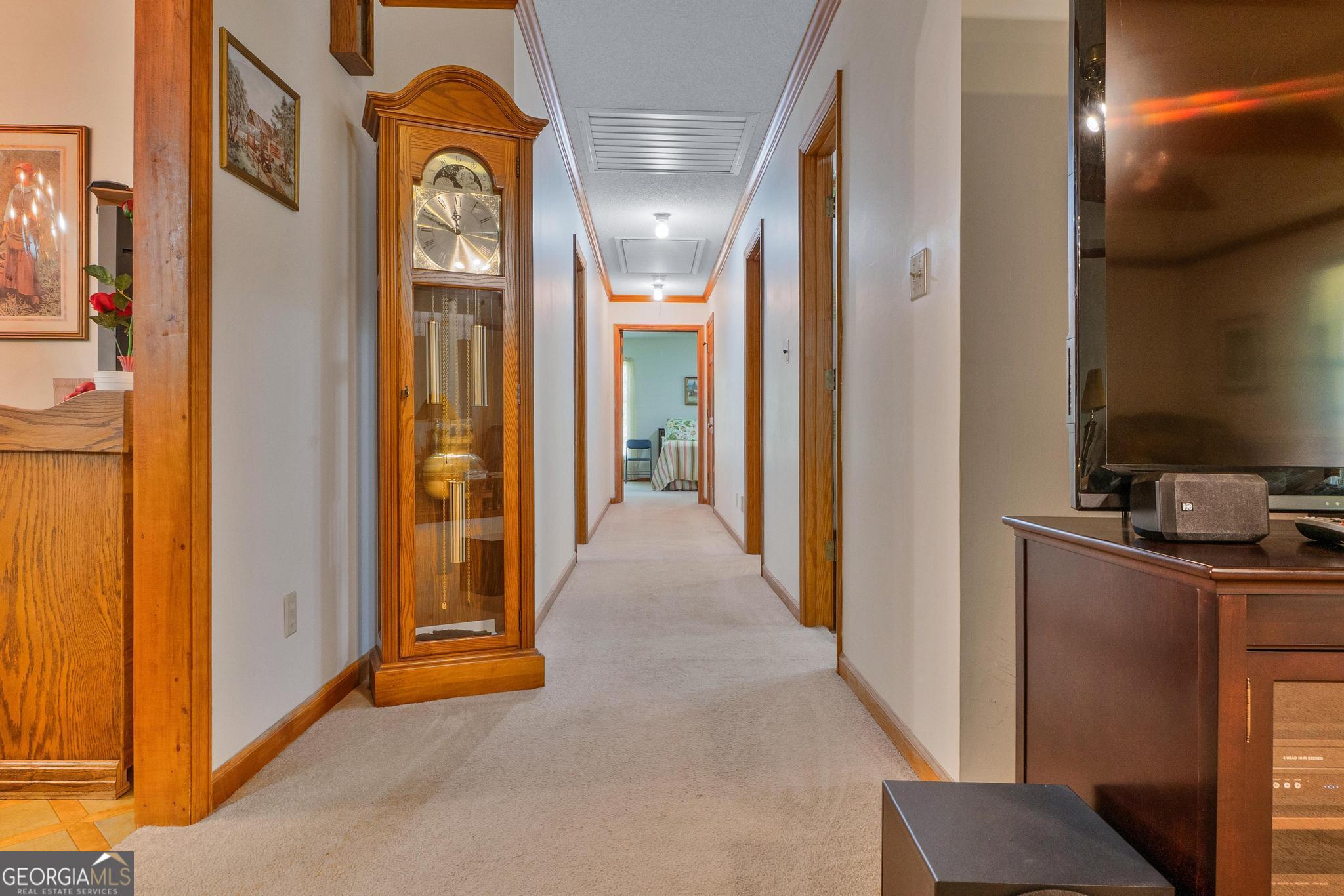 369 Abares Road Forsyth, GA 31029 - Photo 11 of 60 a view of a hallway with paintings on the wall