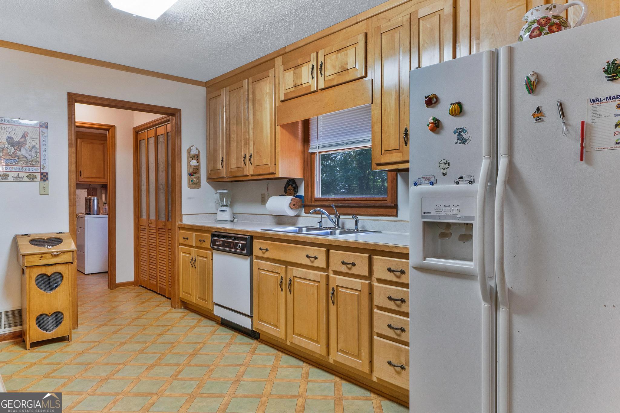 369 Abares Road Forsyth, GA 31029 - Photo 17 of 60 a kitchen with stainless steel appliances granite countertop a refrigerator and a stove