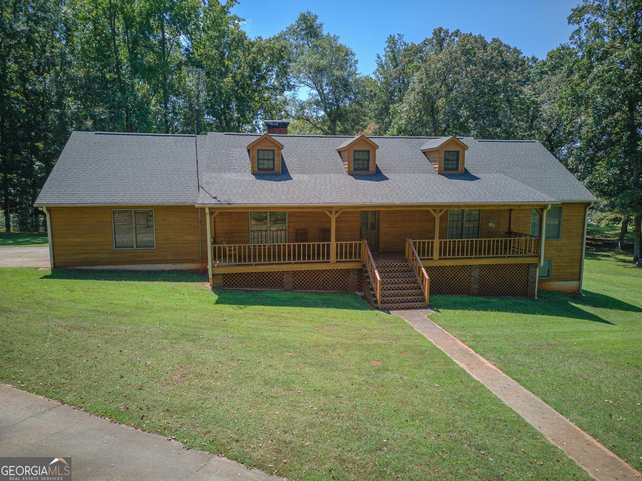 369 Abares Road Forsyth, GA 31029 - Photo 2 of 60 a view of a house with a backyard