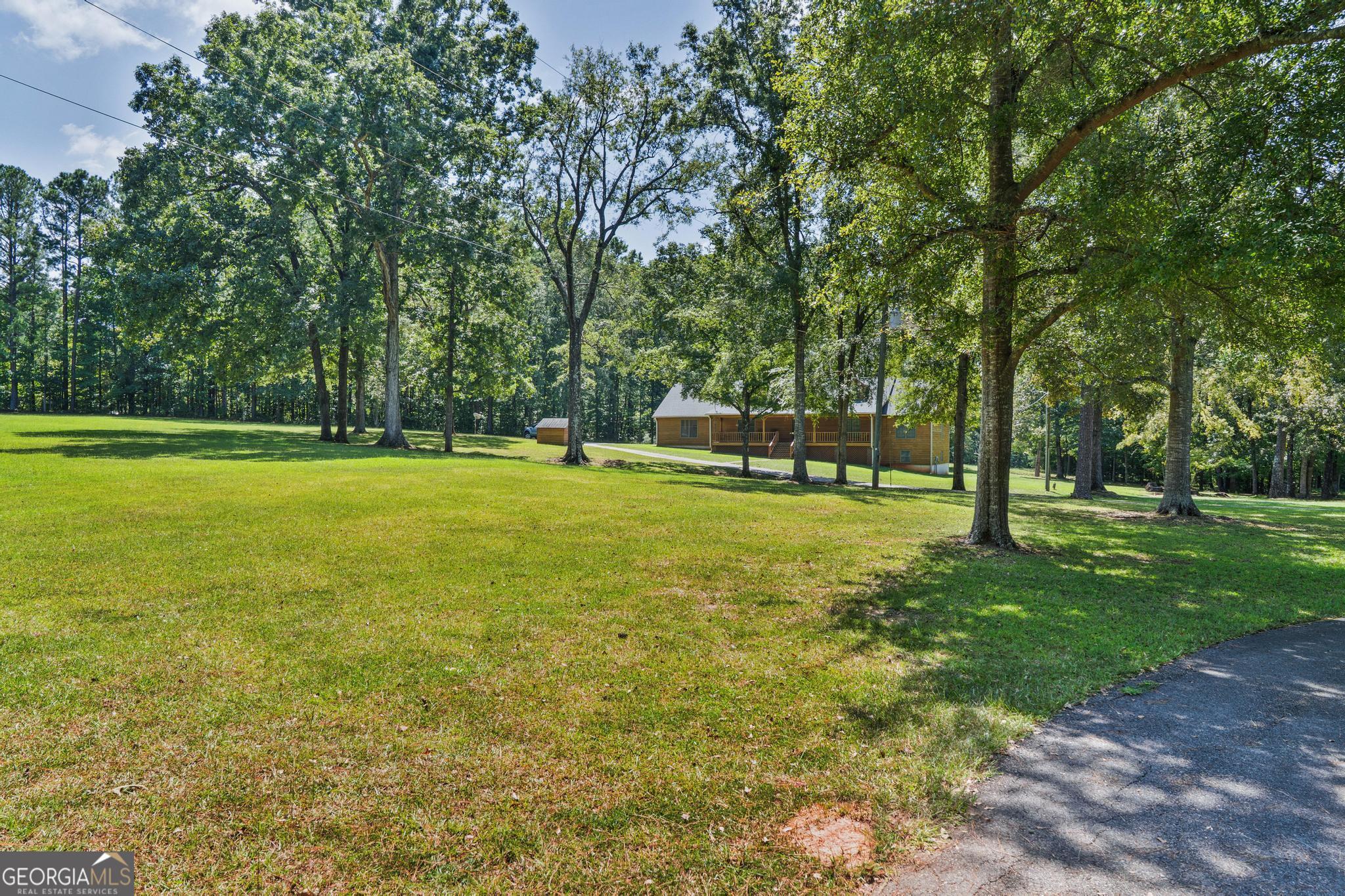 369 Abares Road Forsyth, GA 31029 - Photo 47 of 60 a view of a park with large trees