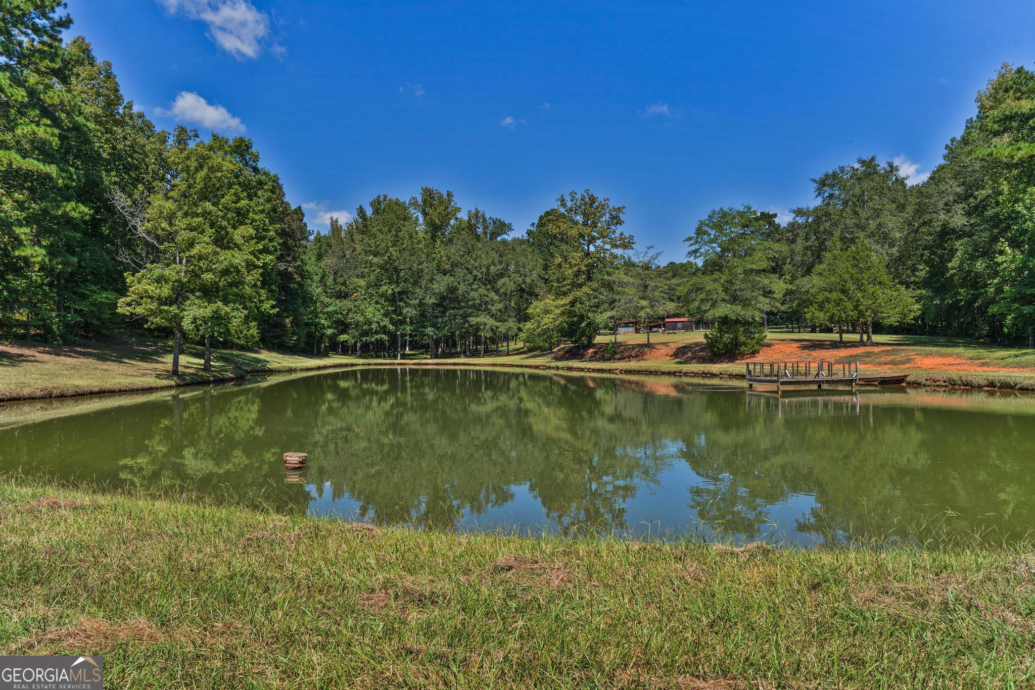 369 Abares Road Forsyth, GA 31029 - Photo 56 of 60 a view of a lake in between two chairs