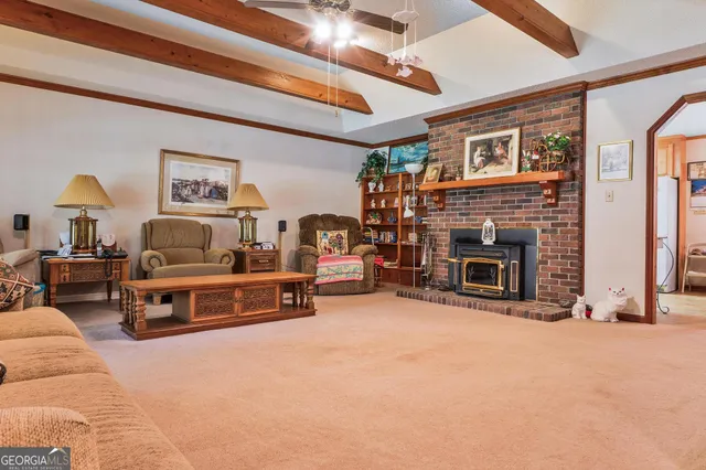 a view of a hallway with paintings on the wall