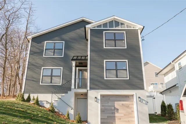 a large kitchen with stainless steel appliances a refrigerator and a stove top oven