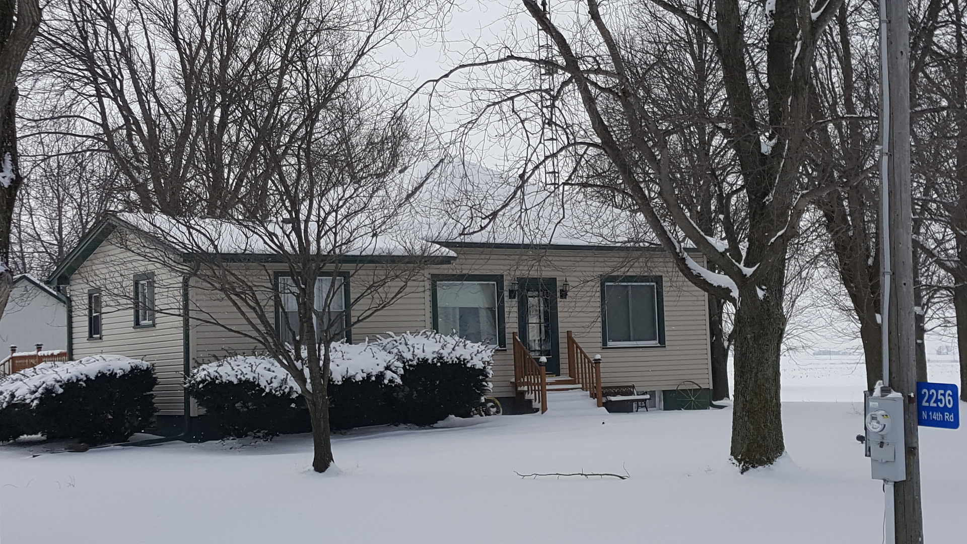 2256 North 14th Road Streator, IL 61364 - Photo 1 of 18 a view of a house with a snow in the yard