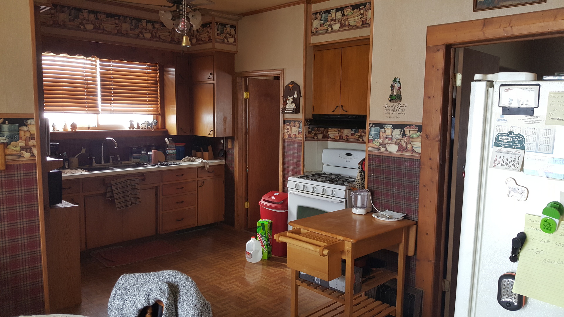 2256 North 14th Road Streator, IL 61364 - Photo 2 of 18 a kitchen with a refrigerator and a stove