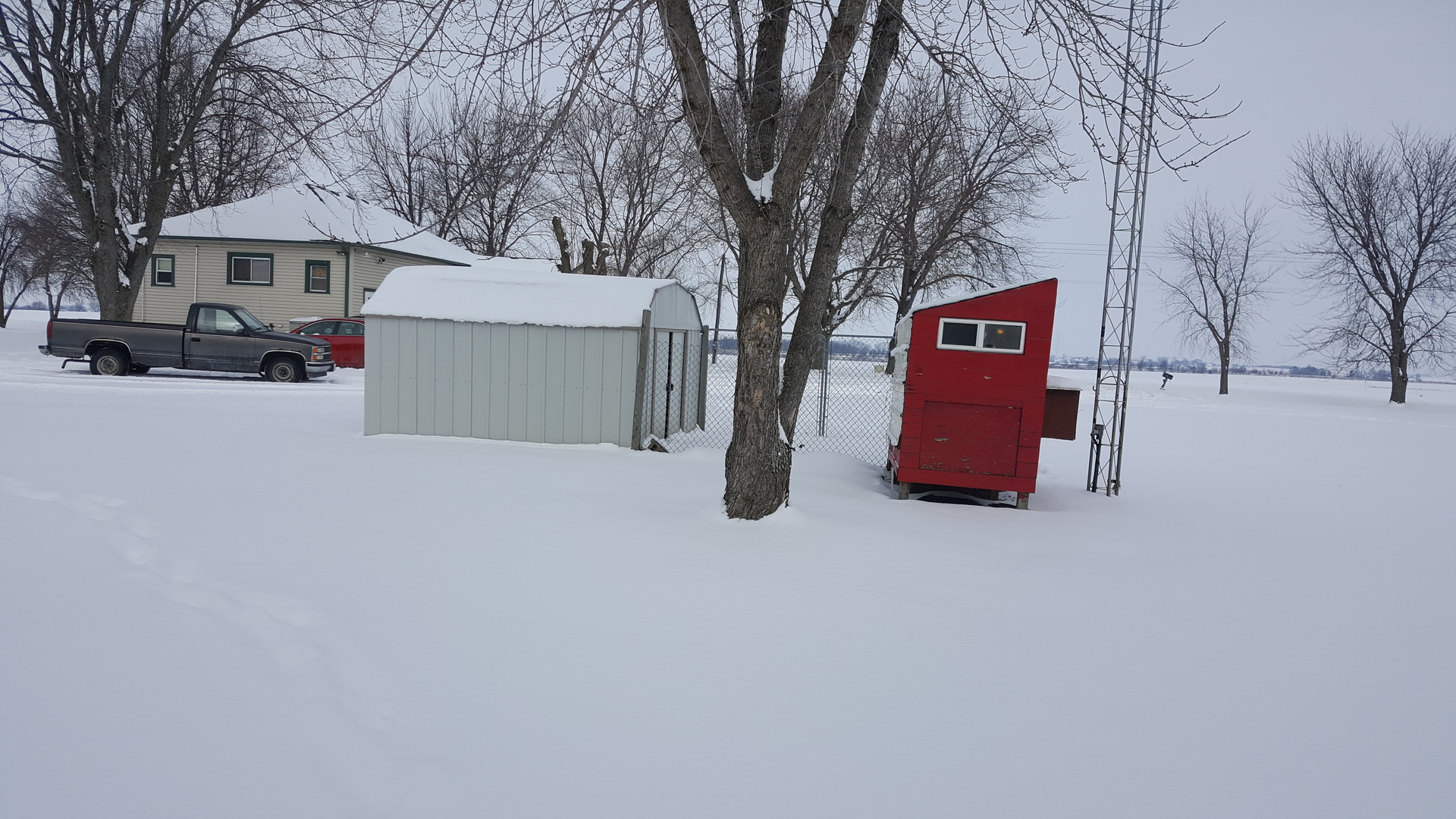 2256 North 14th Road Streator, IL 61364 - Photo 14 of 18 a street view with wooden fence and large trees
