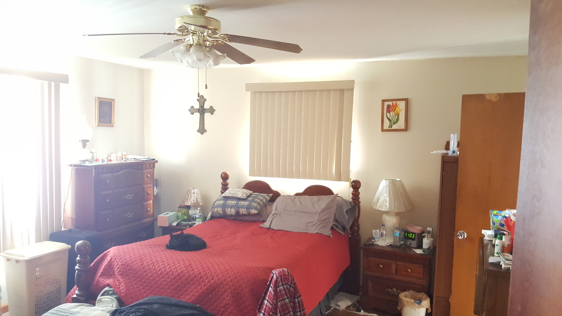 2256 North 14th Road Streator, IL 61364 - Photo 9 of 18 a bedroom with a bed and a chandelier