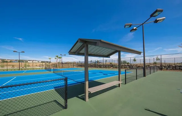 a view of swimming pool with outdoor seating and city view