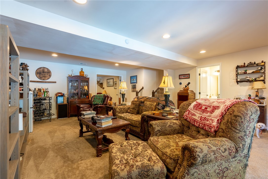 109 Smith Farm Way Easley, SC 29642 - Photo 23 of 37 This inviting basement features plush carpet flooring and recessed lighting, creating a comfortable living space.