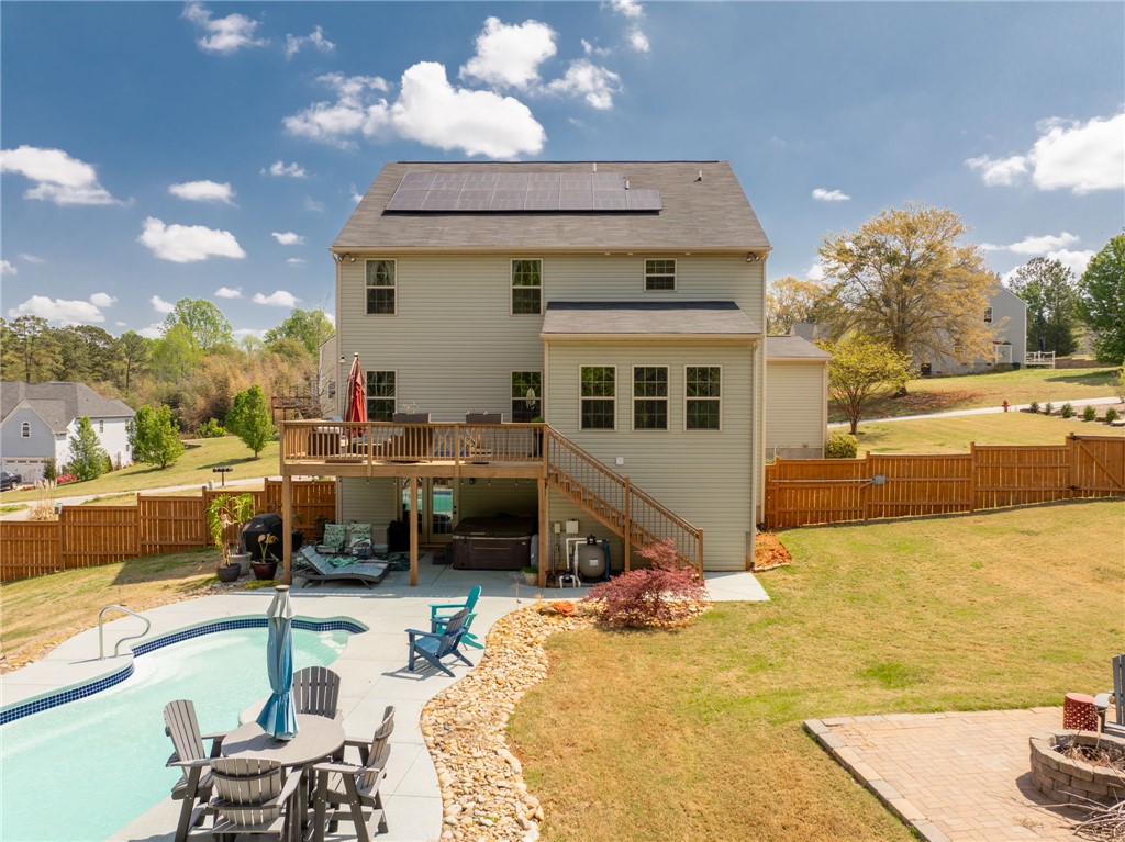 109 Smith Farm Way Easley, SC 29642 - Photo 33 of 37 This home features a refreshing pool, spacious deck, and a fenced yard for privacy and outdoor enjoyment.