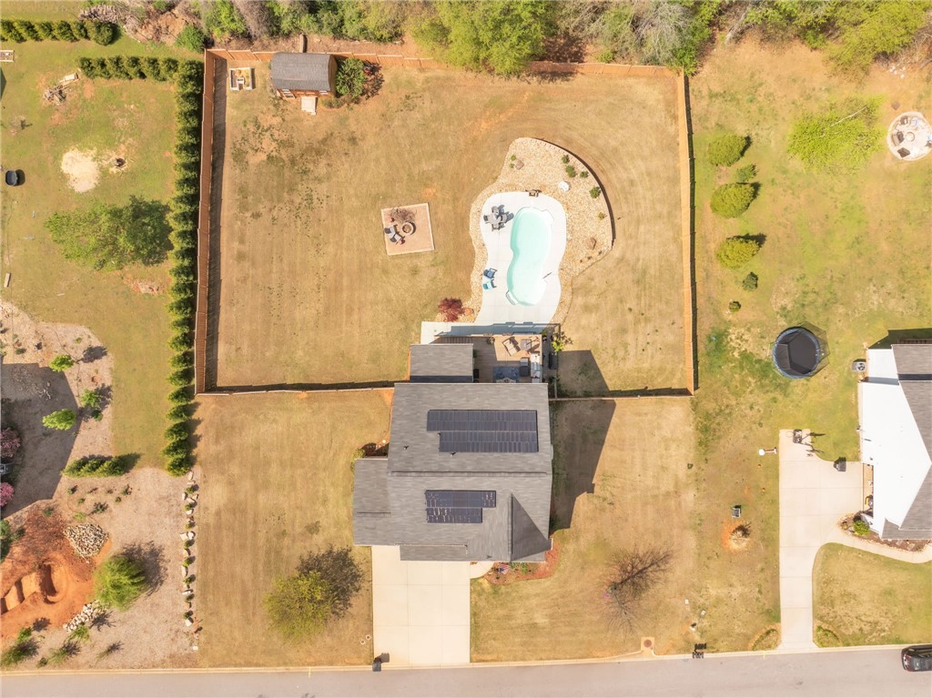 109 Smith Farm Way Easley, SC 29642 - Photo 34 of 37 An aerial view captures the property's expansive yard, showcasing the pool, patio, and additional structures.