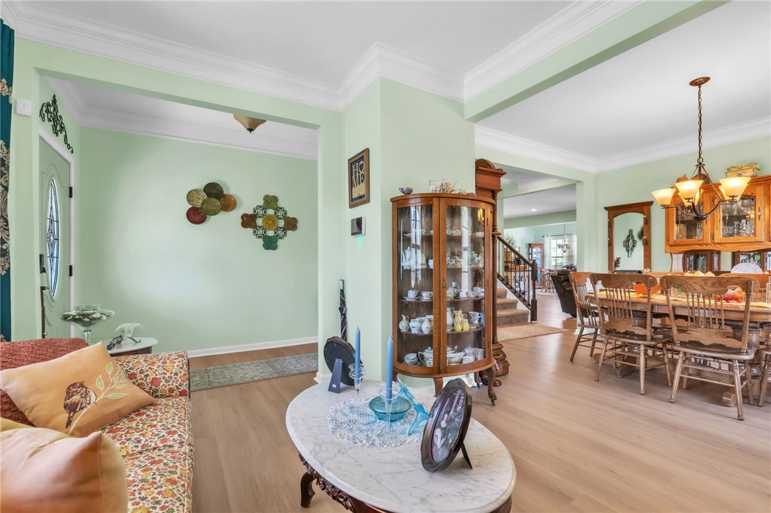 109 Smith Farm Way Easley, SC 29642 - Photo 4 of 37 This inviting interior features elegant flooring and crown molding, creating a warm and welcoming atmosphere.