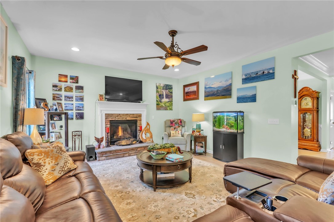 109 Smith Farm Way Easley, SC 29642 - Photo 5 of 37 This inviting living space features a cozy fireplace and warm wood flooring.