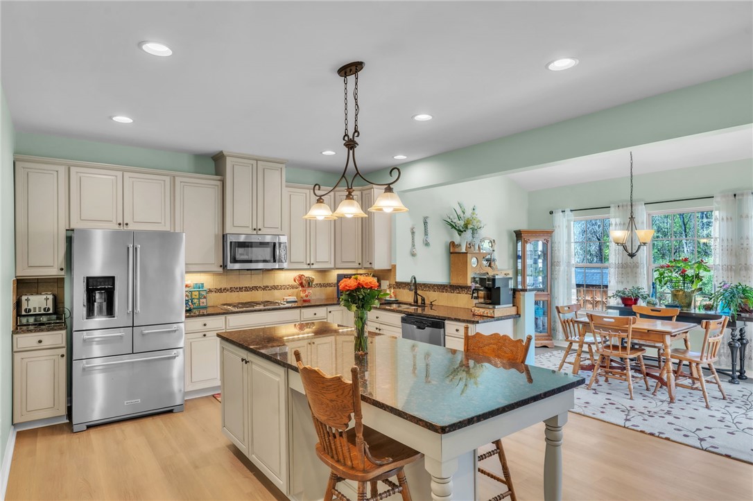 109 Smith Farm Way Easley, SC 29642 - Photo 8 of 37 This kitchen and dining area provides a perfect blend of style and functionality for everyday living.