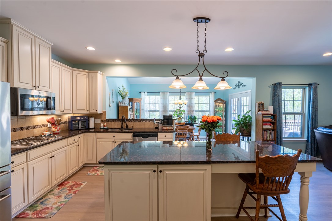 109 Smith Farm Way Easley, SC 29642 - Photo 9 of 37 This kitchen features a central island, ample cabinetry, and an open layout perfect for gatherings.