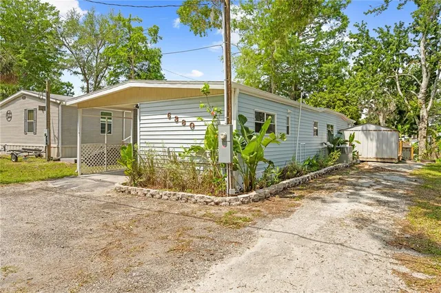a deck view with wooden floor and fence next to a yard