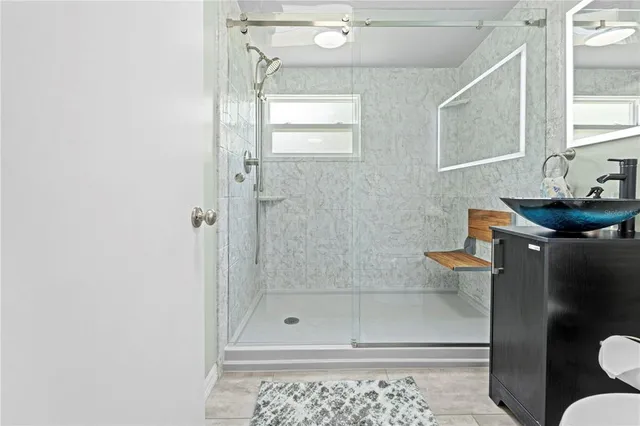 a kitchen with a refrigerator and a stove