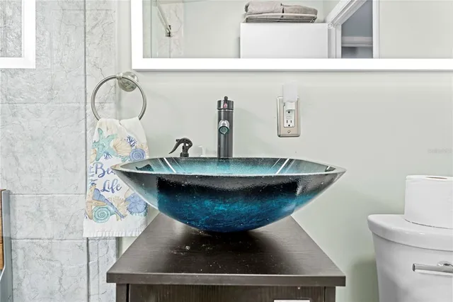 a kitchen with a sink and a stove top oven