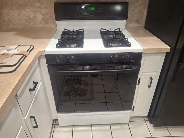a bathroom with a sink vanity and mirror