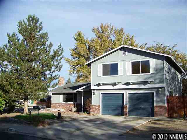 4411 Leche Way Reno, NV 89502 - Photo 1 of 1 a front view of a house with a yard