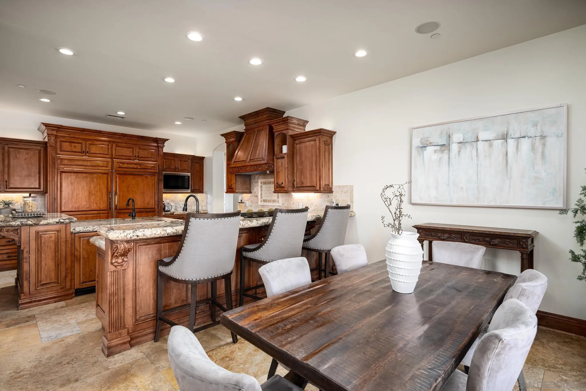 16531 Zumaque Street Rancho Santa Fe, CA 92067 - Photo 16 of 48 a large kitchen with a table and chairs