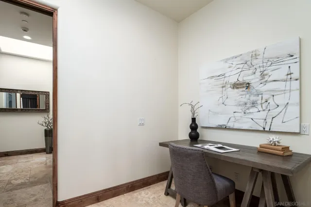 a bedroom with a bed a dresser and chair