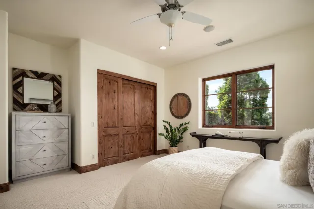 a bedroom with bed and a window