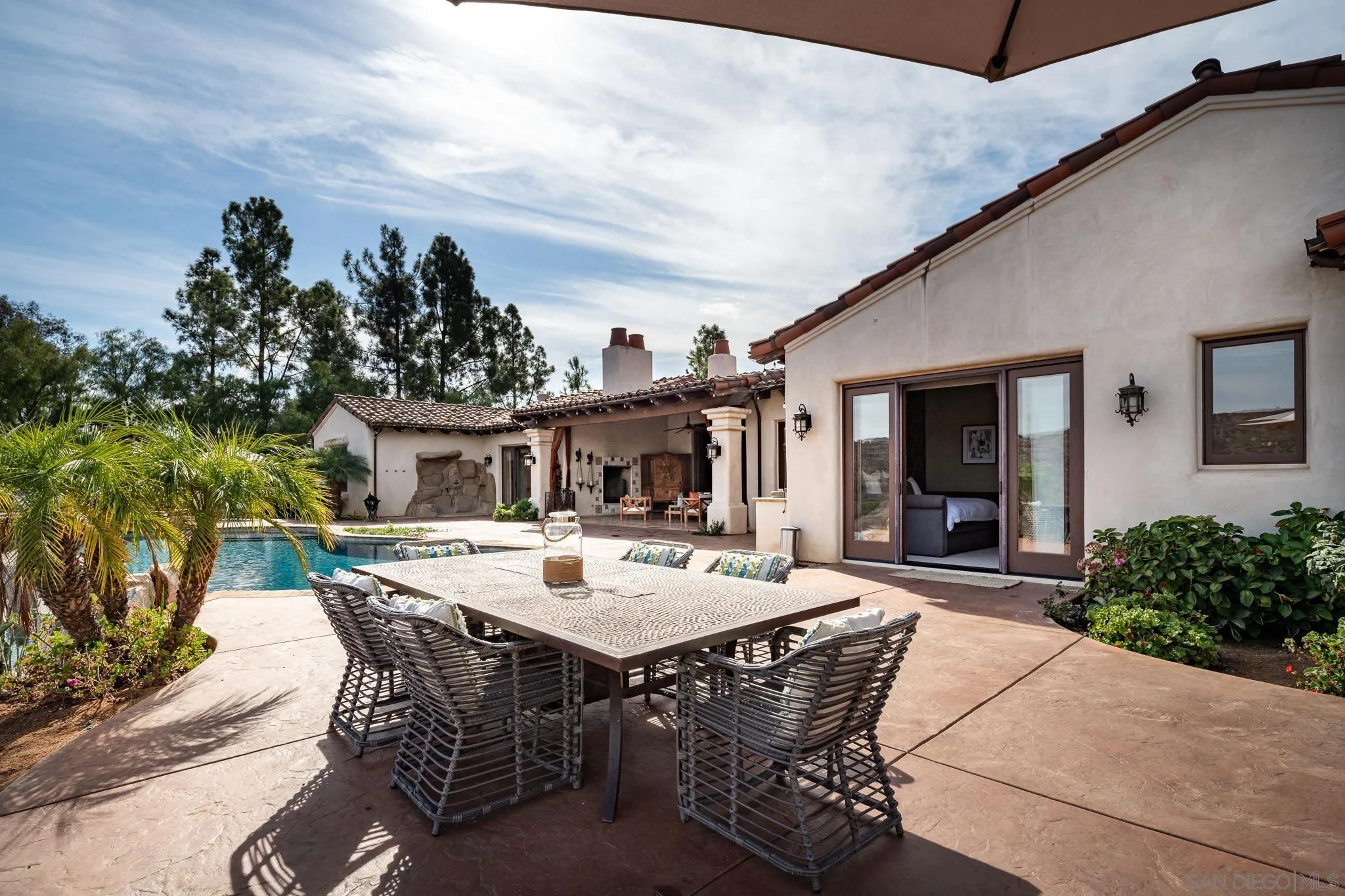 16531 Zumaque Street Rancho Santa Fe, CA 92067 - Photo 33 of 48 a view of a dinning table and chairs in patio of the house
