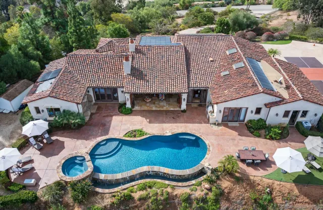 a view of swimming pool with outdoor seating yard and mountain view in back
