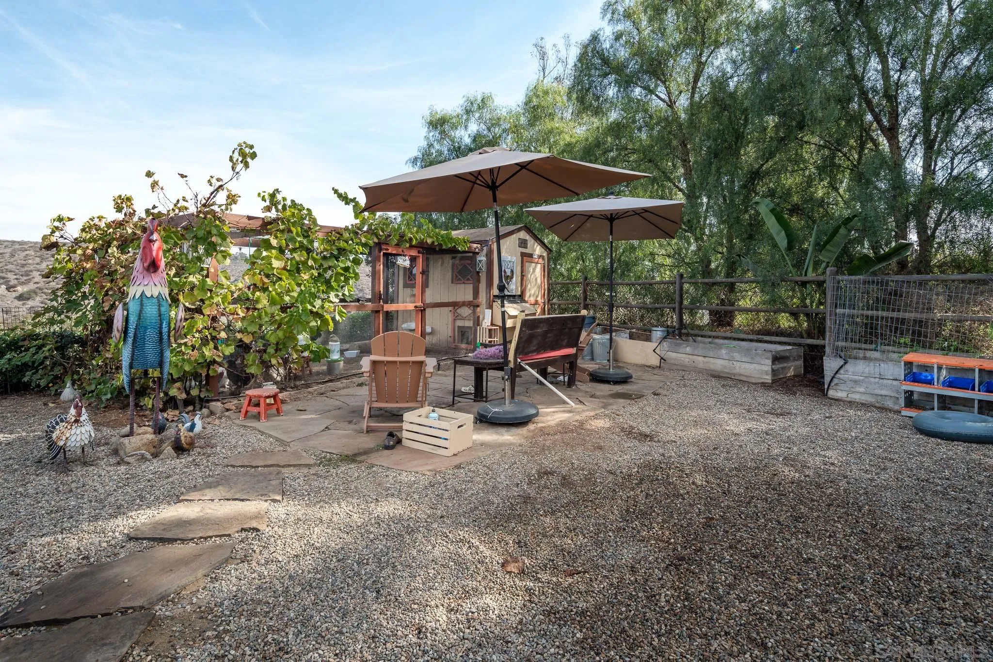 16531 Zumaque Street Rancho Santa Fe, CA 92067 - Photo 40 of 48 a view of backyard with outdoor seating and trees