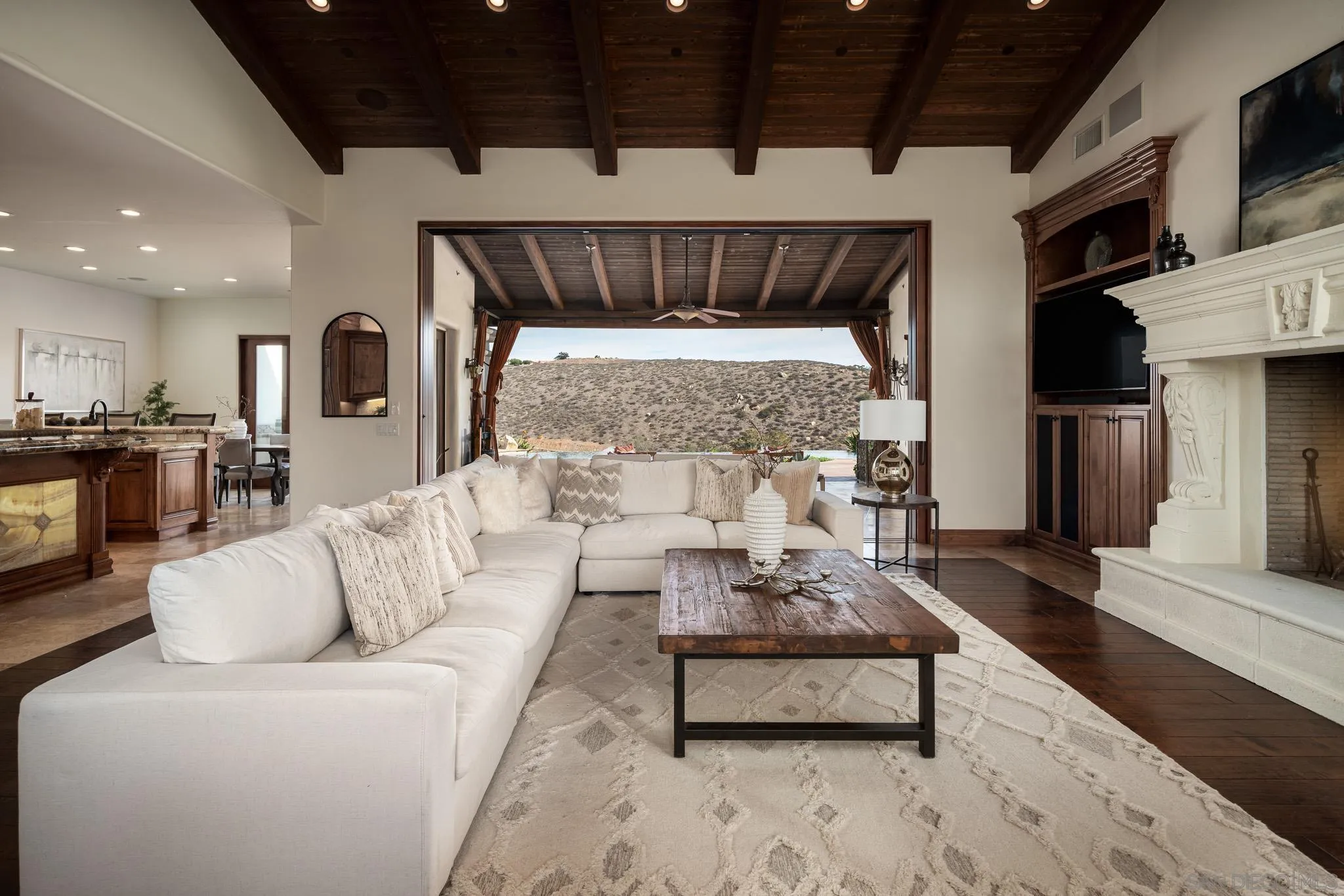 16531 Zumaque Street Rancho Santa Fe, CA 92067 - Photo 5 of 48 a living room with furniture and a fireplace