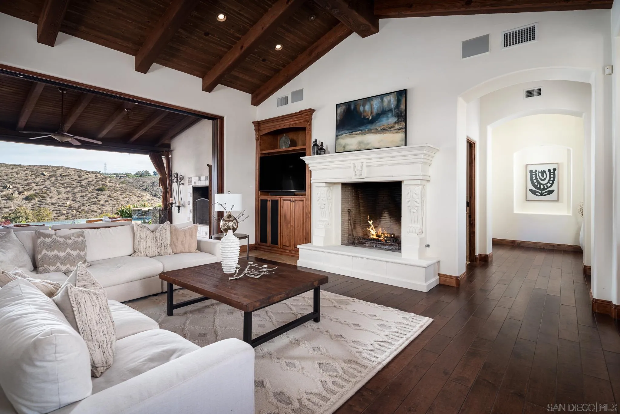 16531 Zumaque Street Rancho Santa Fe, CA 92067 - Photo 6 of 48 a living room with furniture and a fireplace
