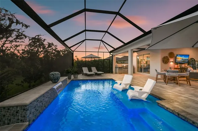 a kitchen with granite countertop a stove and a large window