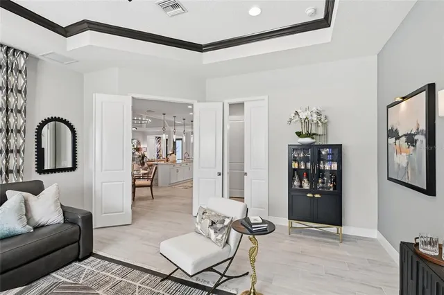 a view of a grassy field with trees in the background