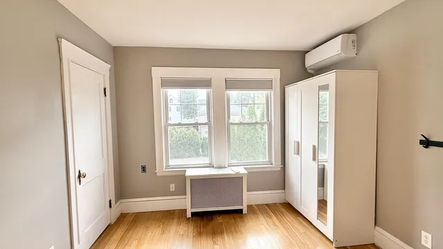 a room with window and wooden floor