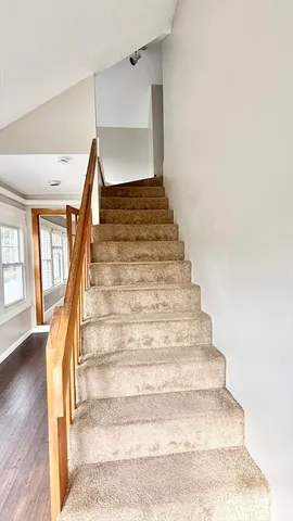 a view of a ceiling fan and entryway