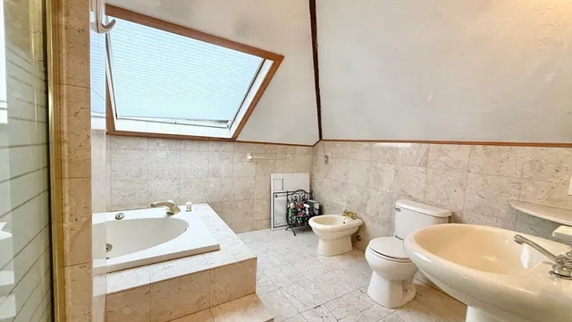 a view of a house with a small yard and wooden floor and fence