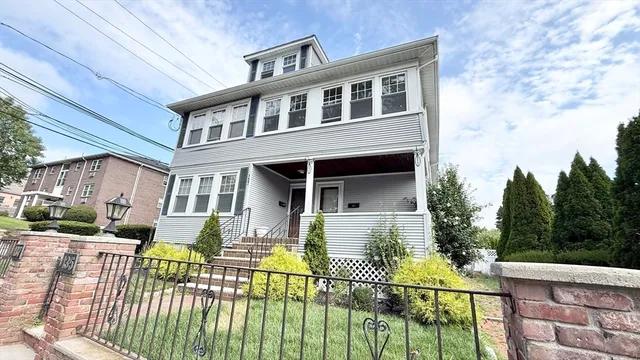 a front view of a house with a patio