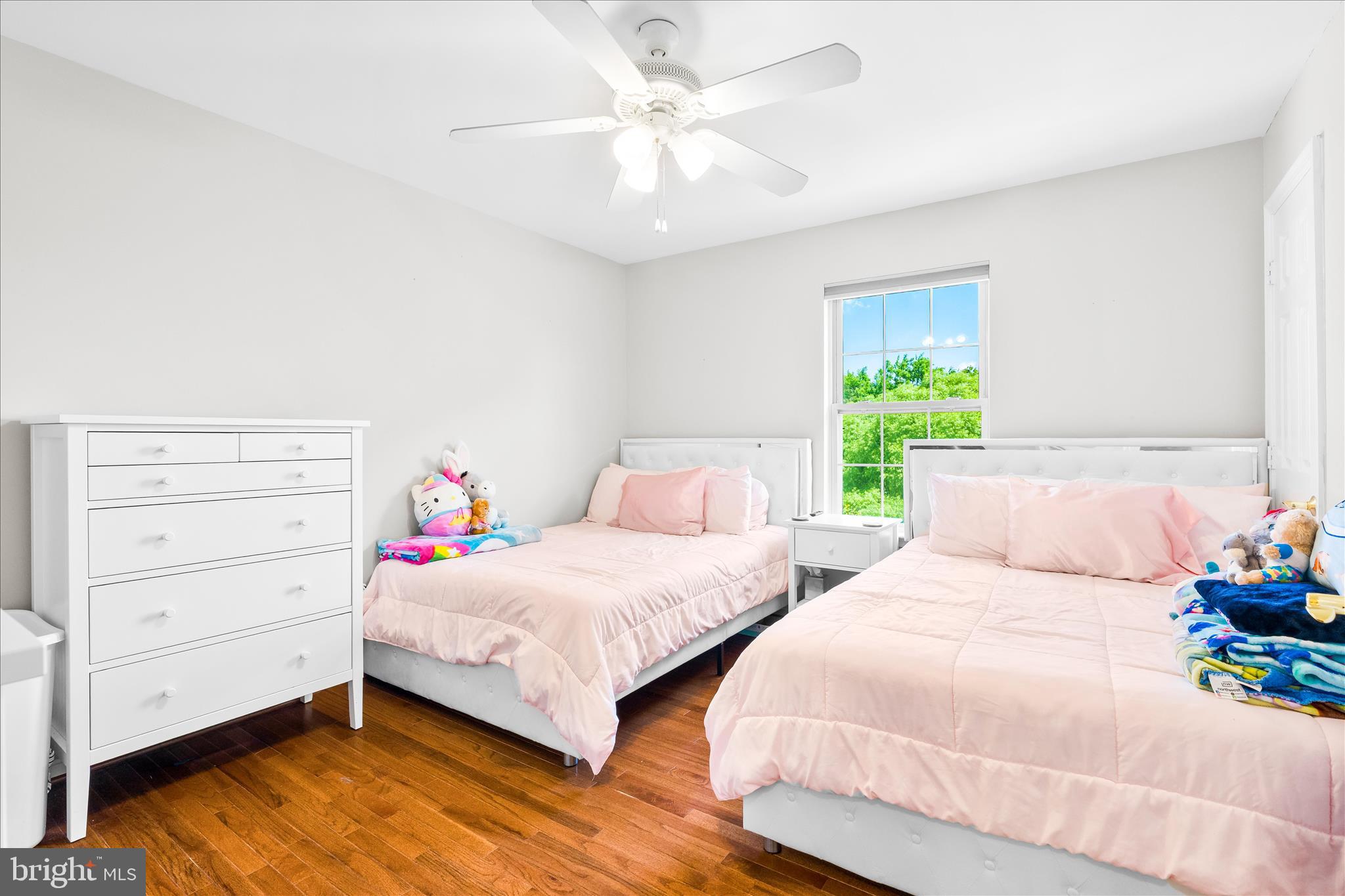 2442 Rippling Brook Road Frederick, MD 21701 - Photo 45 of 85 a bedroom with two beds and a chandelier
