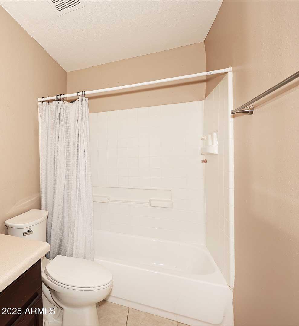 303 North Miller Road, Unit 1007 Scottsdale, AZ 85257 - Photo 24 of 28 a bathroom with a shower a toilet and a shower