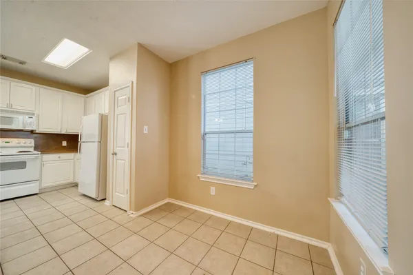 a view of kitchen with furniture and window