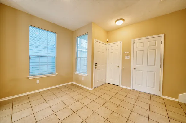 a kitchen with a sink cabinets and window