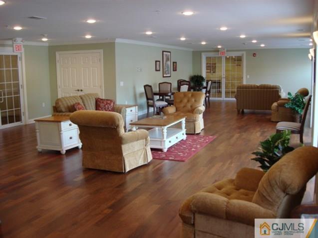 177 Liddle Avenue Edison, NJ 08837 - Photo 4 of 7 a living room with furniture and wooden floor