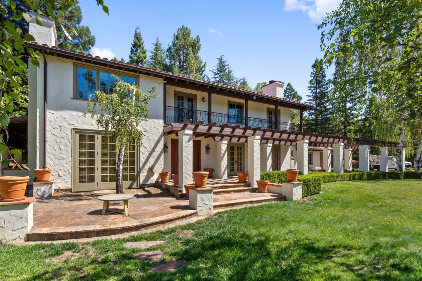 a view of a house with sitting area and furniture